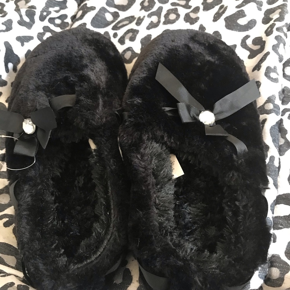 Black furry slippers